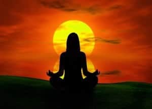 The Great Soul Sync Meditation featuring a silhouette of a woman meditating at sunset.