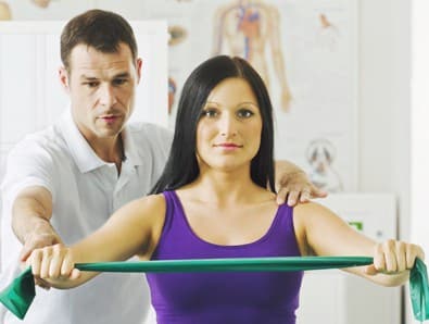 A woman in Fort Lauderdale is receiving assistance from a physical therapist.