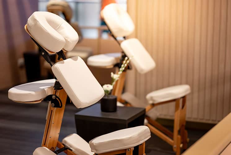 A group of massage chairs in a room.