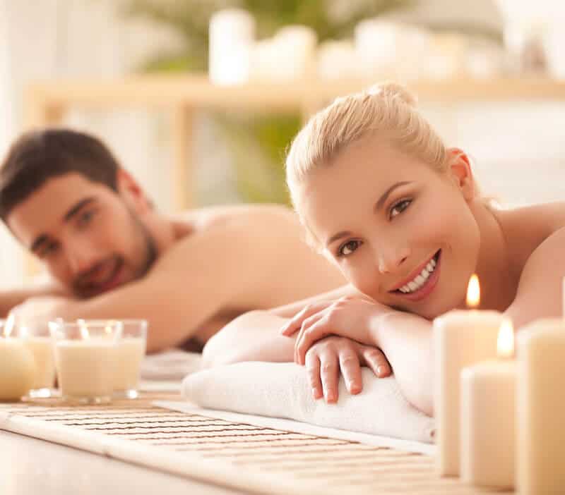 Man and woman having a massage in a spa.