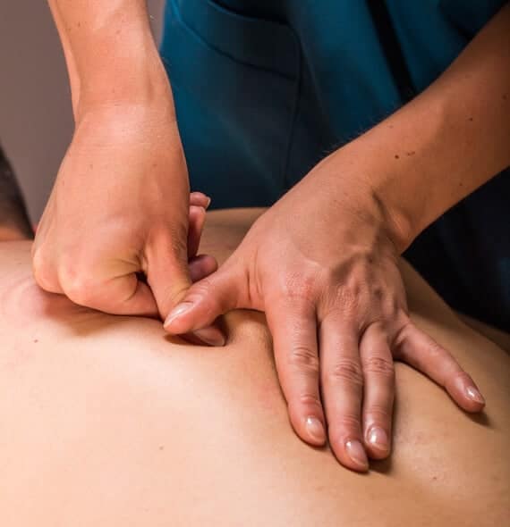 A man getting a massage on his back.