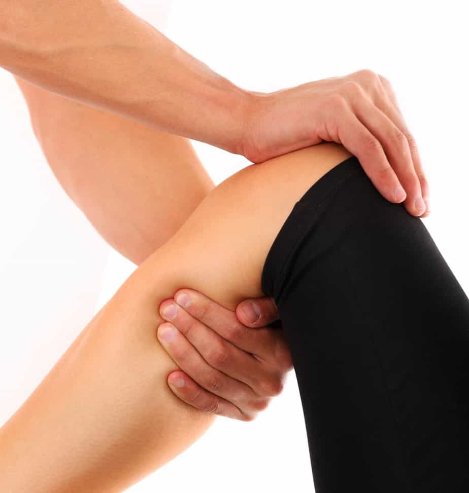 A person holding a knee.