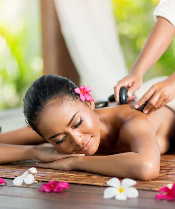 A woman getting a massage at a spa.