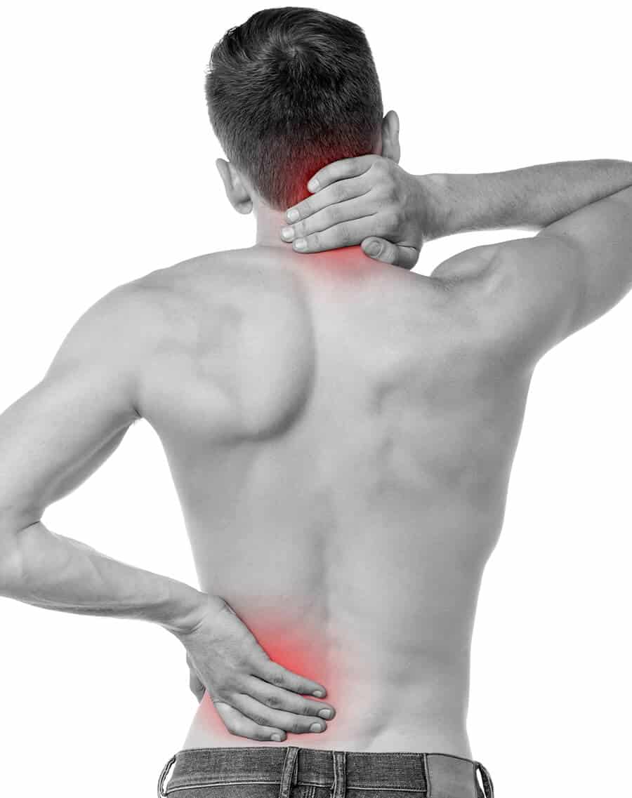 A man with a back pain is holding his back.