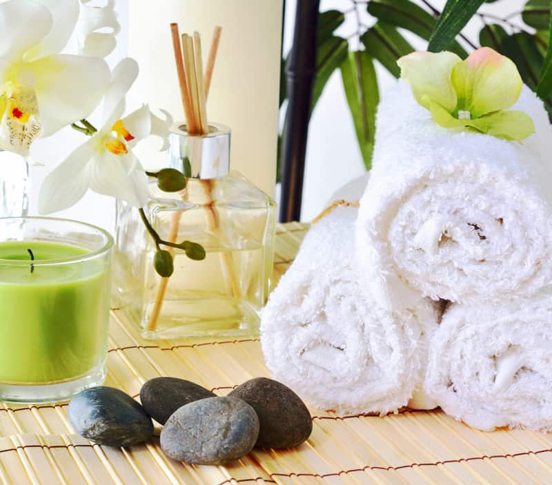 A white towel on a bamboo mat.