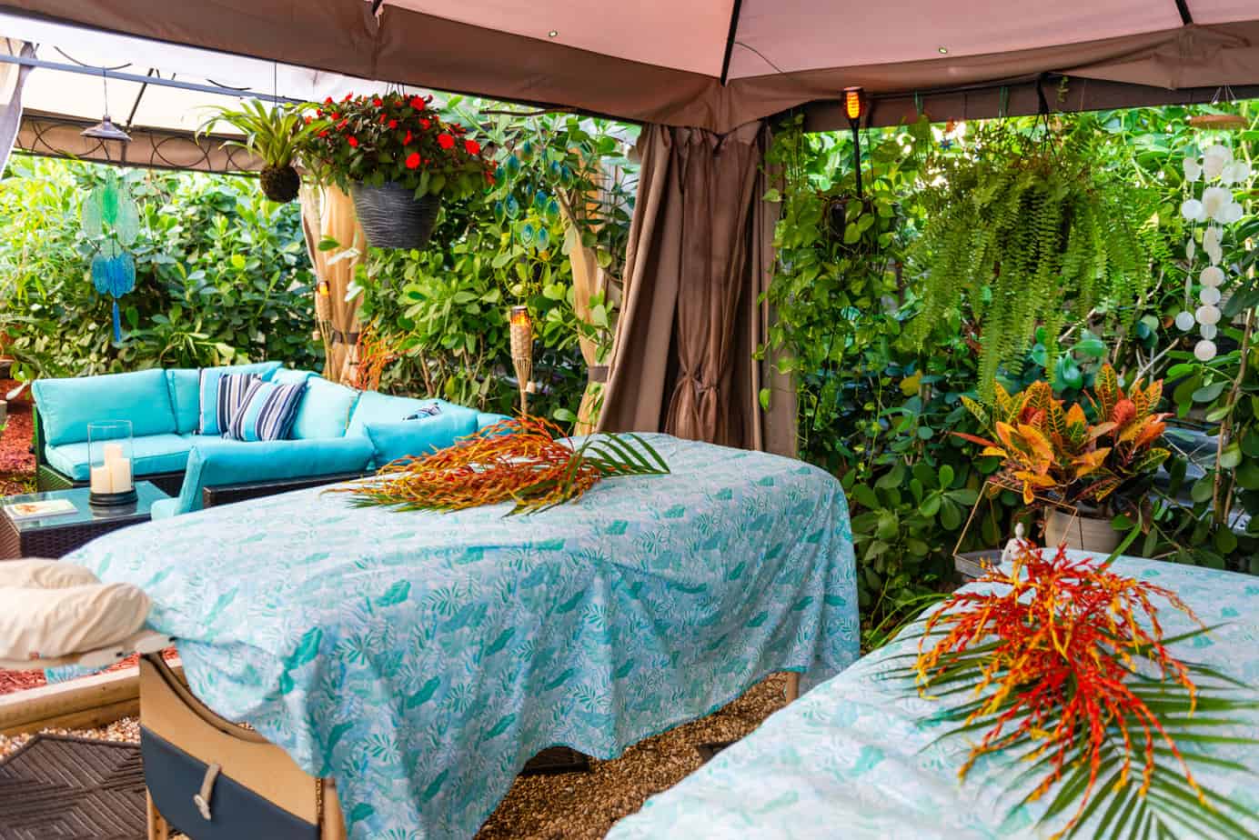 Two massage tables in a garden. Couples Massage with Two massage tables in a garden in Fort Lauderdale Florida